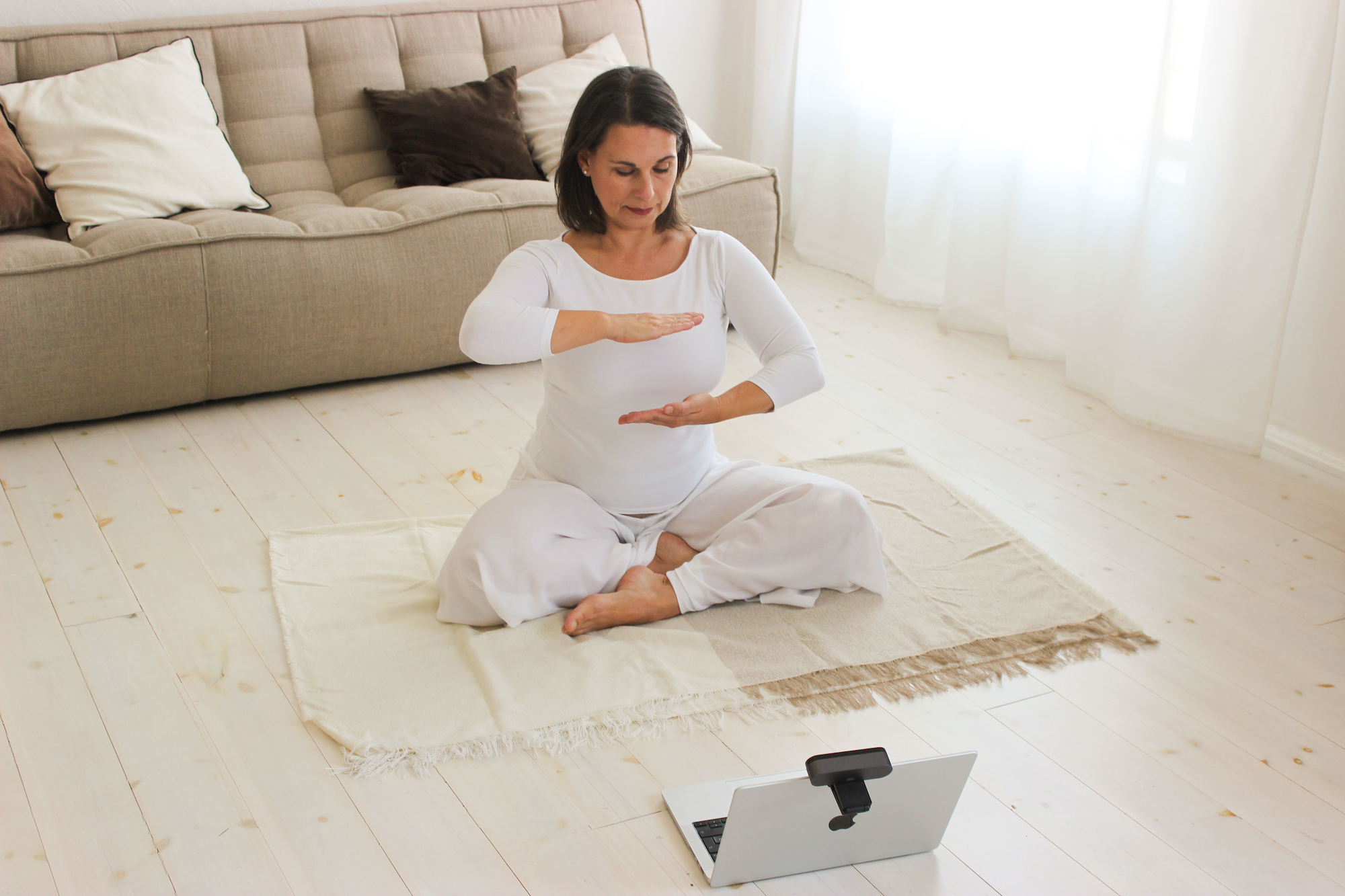 online-yoga-class woman shows yoga exercises during online class